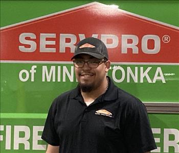 Male employee, crew leader in front of SERVPRO truck